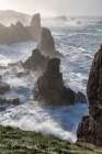 Spain, Liencres. Ocean waves and sea stack formations. Art Print